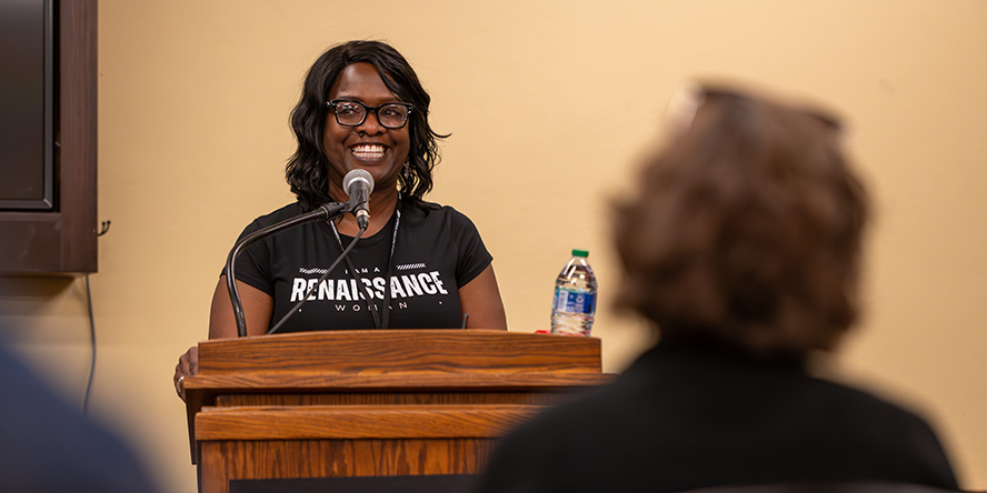 Hunter speaking at the Purdue Women's Conference in 2023.