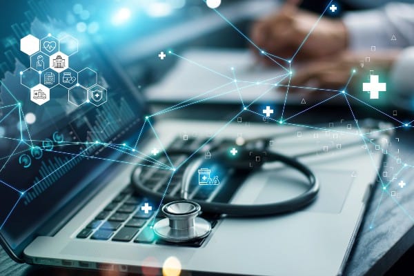 Stethoscope resting on laptop, with an overlay visual of network connections