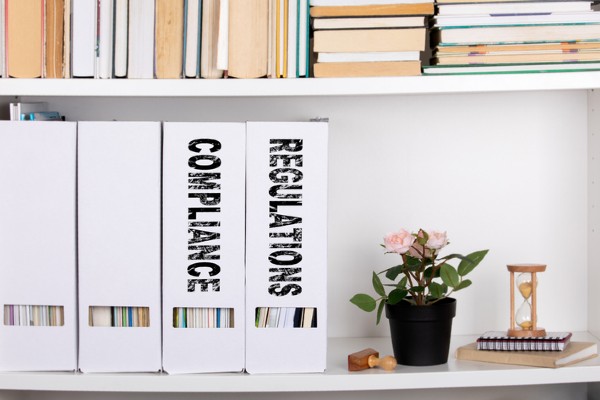 Document folders that are labeled compliance and regulations.