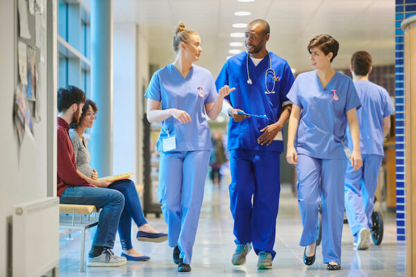 A group of nurses walking