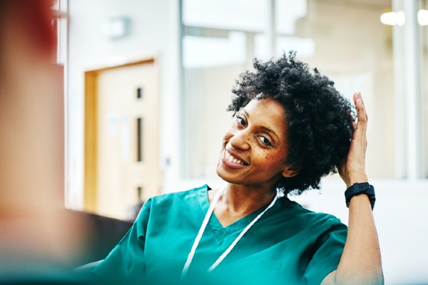 A nurse relaxes during a break.