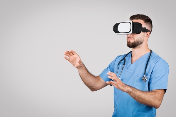 Young male nursing student using a VR headset.