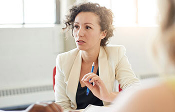 businesswoman leading a meeting