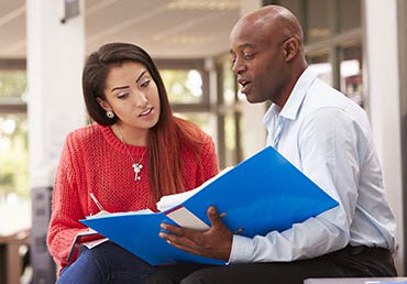Teacher talking to adult students